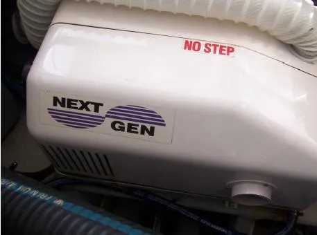 Arcadia Yacht Photos Pics Engine compartment of 2005 Mainship 34 Pilot Rum Runner II with "Next Gen" label.