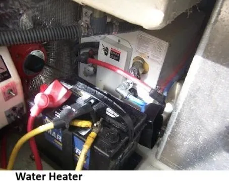 Arcadia Yacht Photos Pics 2005 Mainship 34 Pilot Rum Runner II engine compartment with battery and water heater.