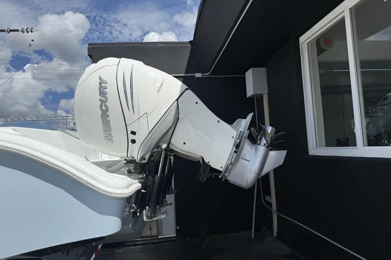  Yacht Photos Pics 2021 Yellowfin 36 Offshore with Mercury outboard engine, parked near a building.