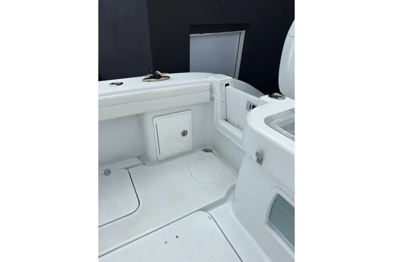  Yacht Photos Pics 2021 Yellowfin 36 Offshore boat interior with storage compartments and seating area.