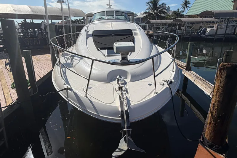  Yacht Photos Pics 2002 Sea Ray 480 Motor Yacht docked at marina, front view.