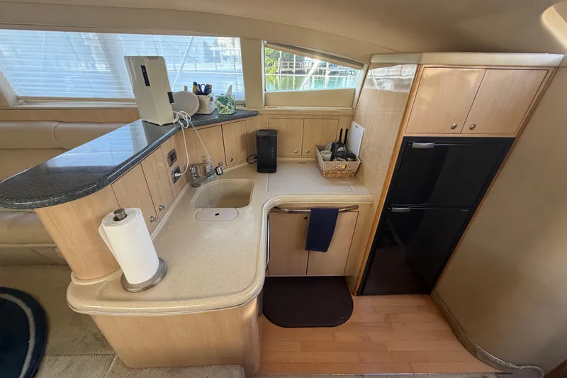  Yacht Photos Pics Luxurious 2002 Sea Ray 480 Motor Yacht kitchen with modern amenities and sleek design.