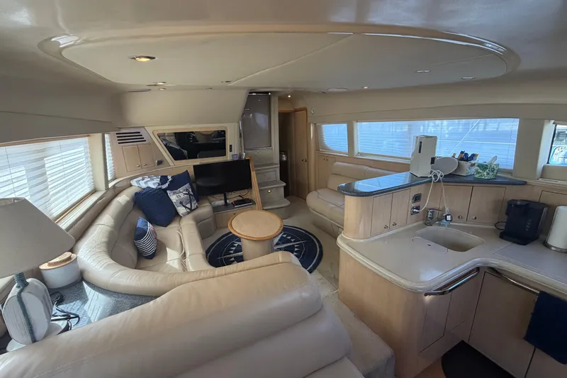  Yacht Photos Pics Luxurious interior of 2002 Sea Ray 480 Motor Yacht with plush seating and modern amenities.