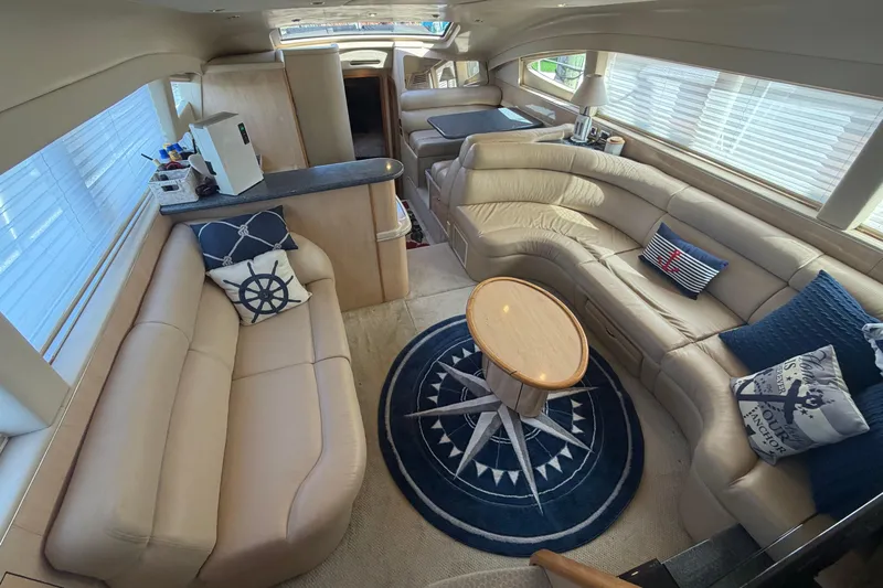  Yacht Photos Pics Luxurious interior of 2002 Sea Ray 480 Motor Yacht with plush seating and nautical decor.