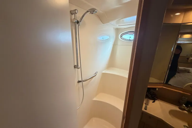  Yacht Photos Pics Shower area in 2002 Sea Ray 480 Motor Yacht with oval windows and sleek design.