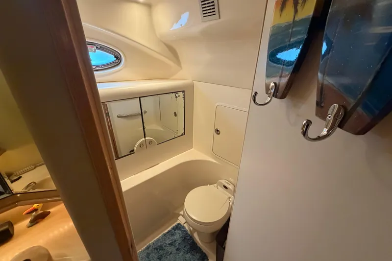  Yacht Photos Pics Bathroom interior of 2002 Sea Ray 480 Motor Yacht with mirror and toilet.