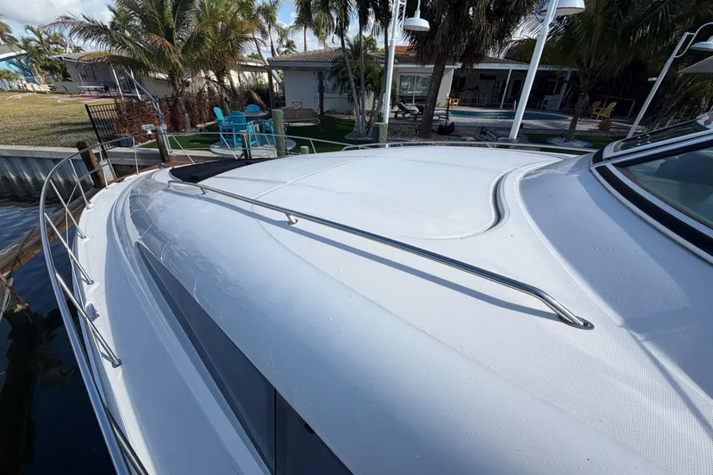  Yacht Photos Pics 2002 Sea Ray 480 Motor Yacht docked near tropical garden setting.