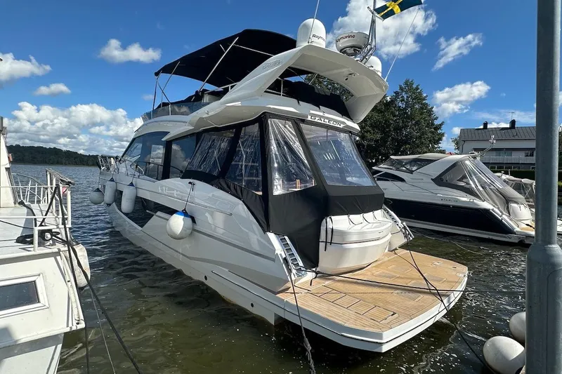  Yacht Photos Pics 2024 Galeon 500 Fly yacht docked on a sunny day, showcasing sleek design and luxury features.
