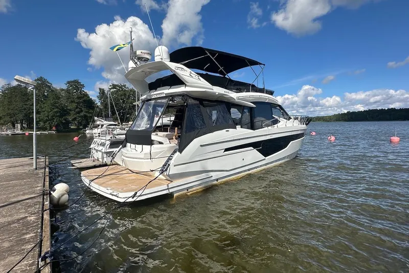  Yacht Photos Pics 2024 Galeon 500 Fly yacht docked on a sunny day with blue skies.