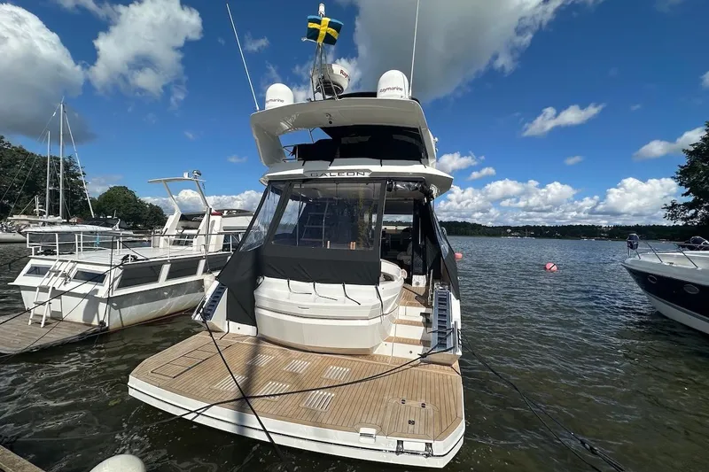  Yacht Photos Pics 2024 Galeon 500 Fly yacht docked on a sunny day with blue skies.