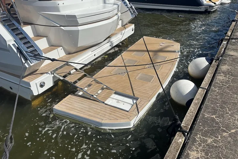  Yacht Photos Pics 2024 Galeon 500 Fly yacht with extended swim platform at dock.