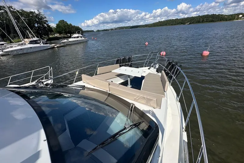  Yacht Photos Pics 2024 Galeon 500 Fly yacht on serene water with spacious deck seating.