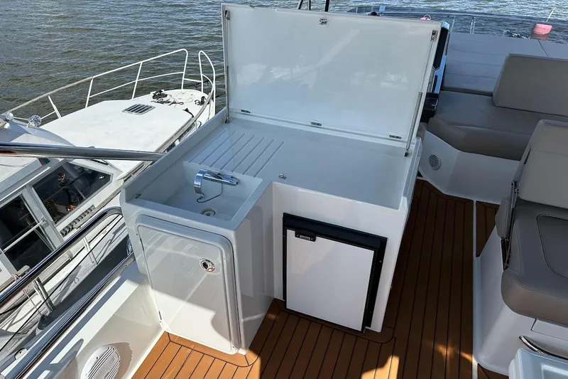  Yacht Photos Pics 2024 Galeon 500 Fly yacht deck with sink and mini fridge.