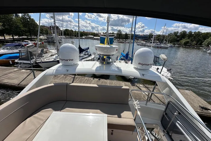  Yacht Photos Pics 2024 Galeon 500 Fly yacht docked at a marina, featuring Raymarine equipment.