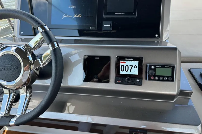  Yacht Photos Pics Helm of 2024 Galeon 500 Fly yacht with advanced navigation controls and steering wheel.