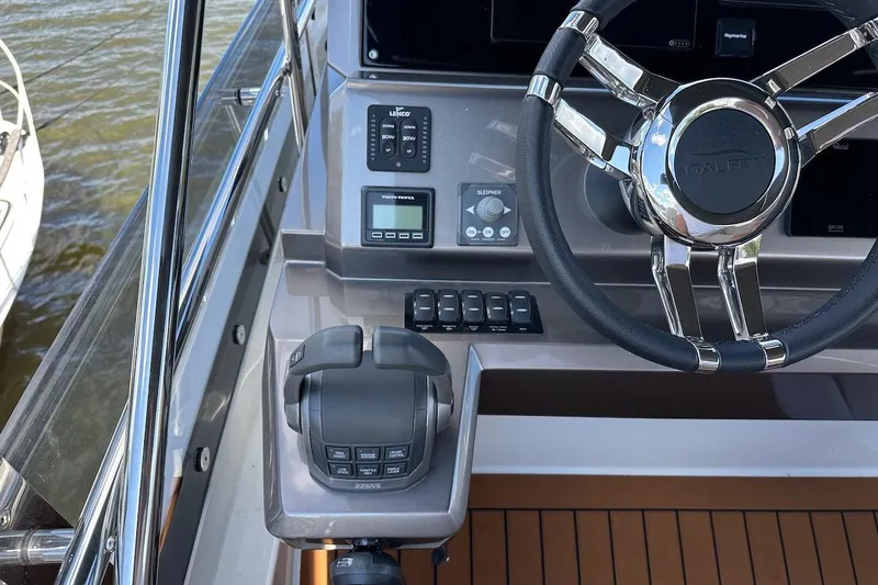 Yacht Photos Pics 2024 Galeon 500 Fly yacht helm with steering wheel and control panel.