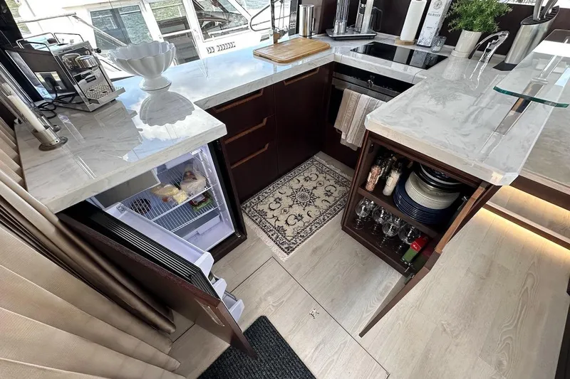  Yacht Photos Pics Luxurious 2024 Galeon 500 Fly yacht kitchen with modern appliances and elegant design.