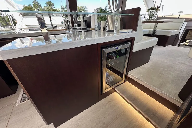  Yacht Photos Pics Luxurious interior of 2024 Galeon 500 Fly yacht with modern kitchenette and mini fridge.