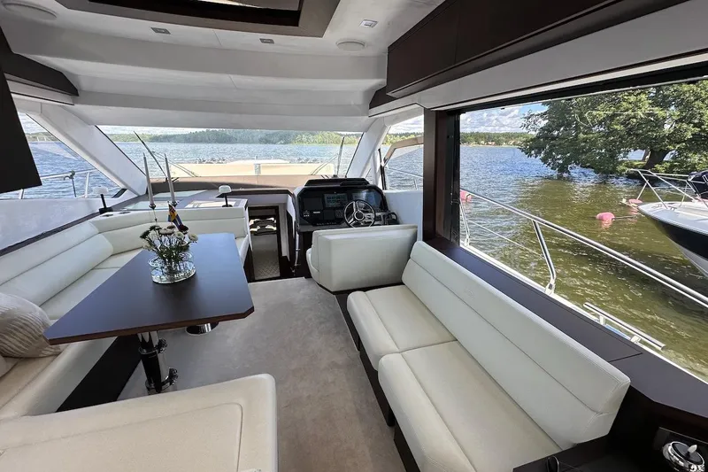  Yacht Photos Pics Luxurious interior of 2024 Galeon 500 Fly yacht with elegant seating and scenic water views.