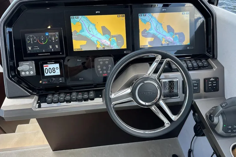  Yacht Photos Pics 2024 Galeon 500 Fly yacht dashboard with navigation screens and steering wheel.