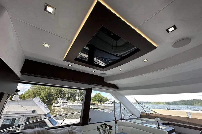  Yacht Photos Pics Luxurious interior of 2024 Galeon 500 Fly yacht with scenic marina view.