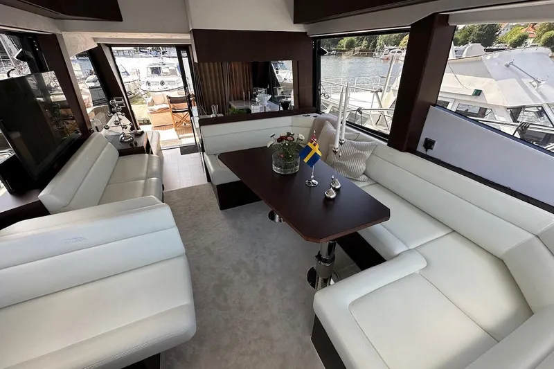  Yacht Photos Pics Luxurious interior of 2024 Galeon 500 Fly yacht with elegant seating and table.
