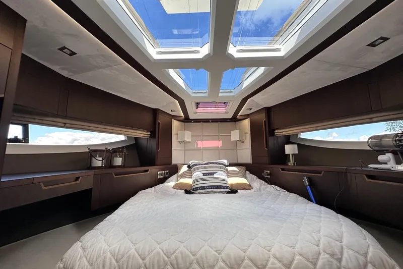  Yacht Photos Pics Luxurious interior of 2024 Galeon 500 Fly yacht with skylight and elegant bedding.