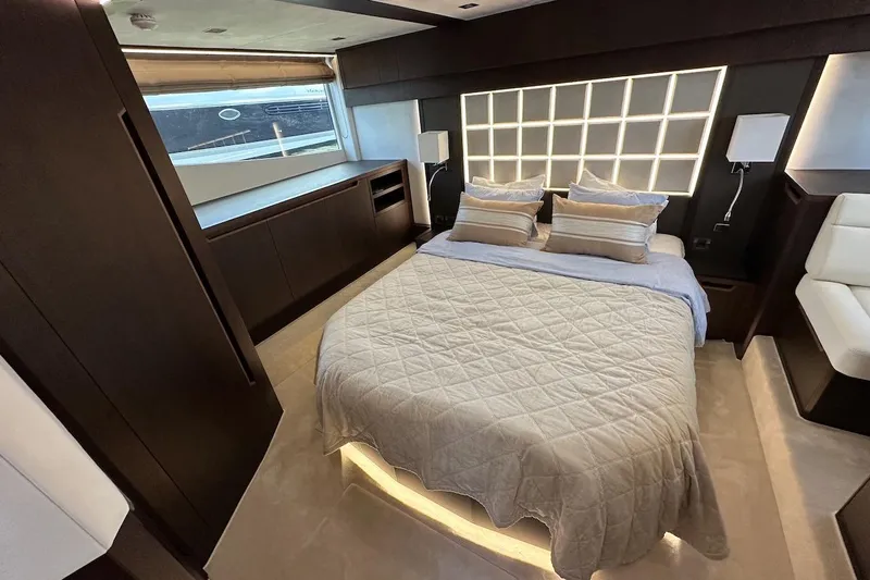  Yacht Photos Pics Luxurious bedroom interior of 2024 Galeon 500 Fly yacht with modern design and ambient lighting.