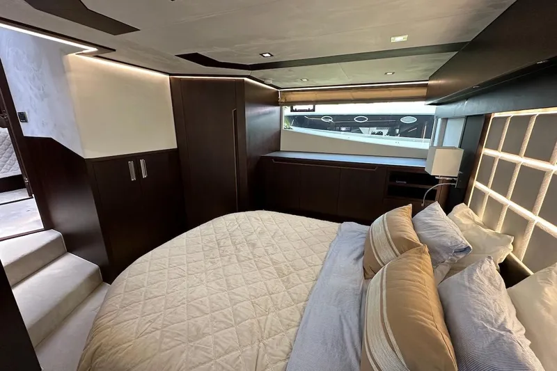  Yacht Photos Pics Luxurious bedroom interior of 2024 Galeon 500 Fly yacht with modern design and elegant furnishings.