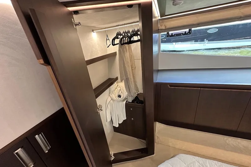  Yacht Photos Pics Luxurious closet interior on 2024 Galeon 500 Fly yacht with hangers and robe.