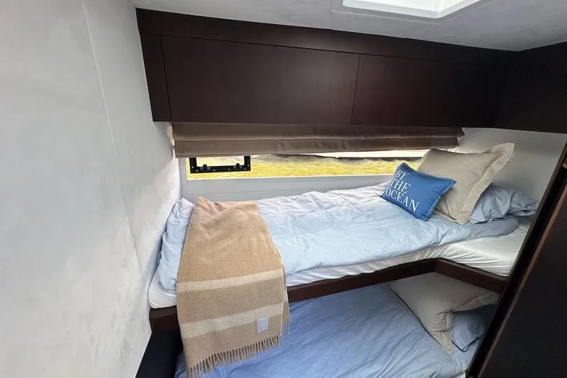  Yacht Photos Pics 2024 Galeon 500 Fly yacht interior with cozy bunk beds and ocean-themed decor.