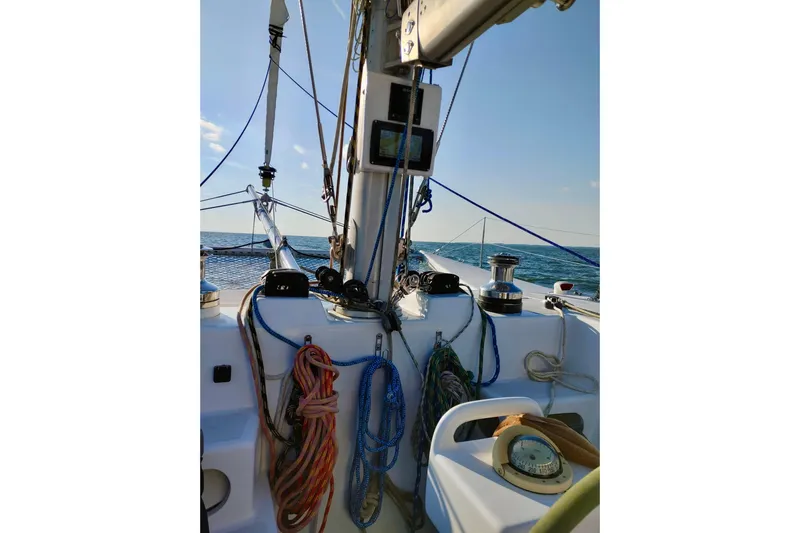 Watermark Yacht Photos Pics Cockpit view of 2003 Chris White Atlantic 42 sailboat with ropes and ocean backdrop.