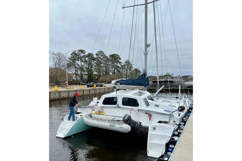 Watermark Yacht Photos Pics 2003 Chris White Atlantic 42 catamaran docked with a person on deck.