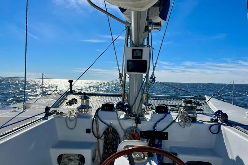 Watermark Yacht Photos Pics Sailing on a 2003 Chris White Atlantic 42 catamaran under clear blue skies.