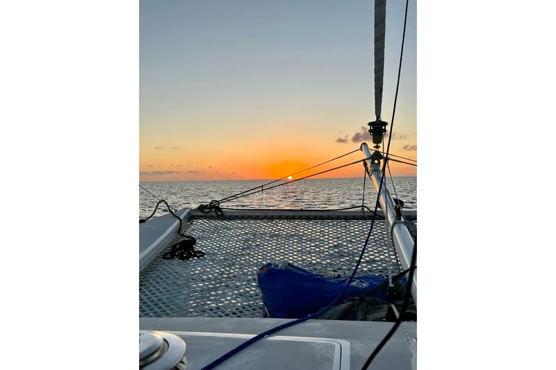 Watermark Yacht Photos Pics Catamaran Chris White Atlantic 42 sailing at sunset, 2003 model, ocean view.