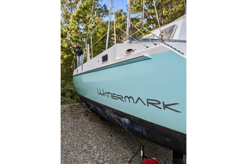 Watermark Yacht Photos Pics 2003 Chris White Atlantic 42 catamaran "Watermark" on land, with person cleaning.