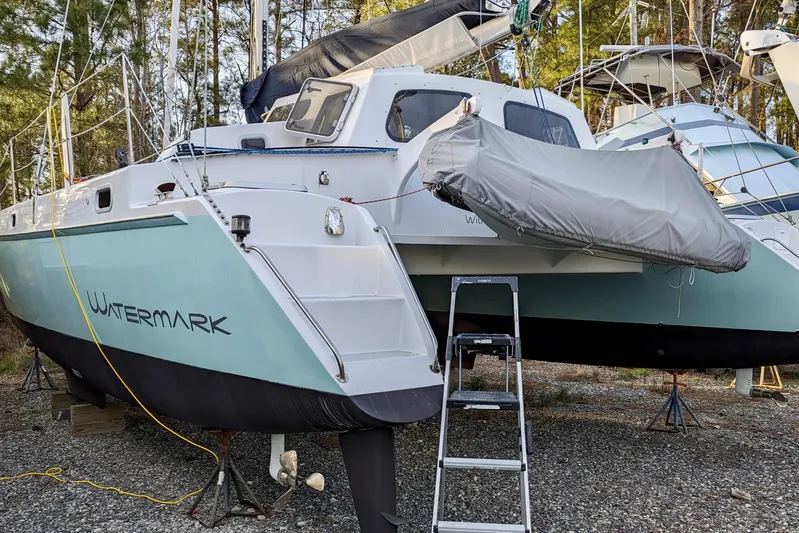 Watermark Yacht Photos Pics 2003 Chris White Atlantic 42 catamaran "Watermark" on land, with dinghy and ladder.