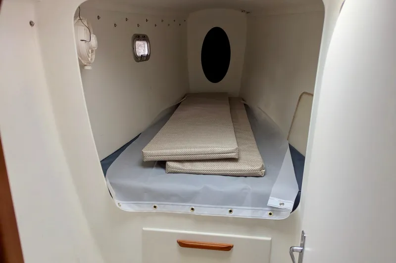 Watermark Yacht Photos Pics Small cabin interior of 2003 Chris White Atlantic 42 sailboat with bedding.