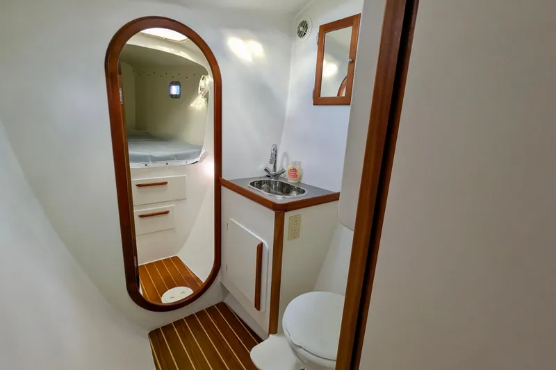 Watermark Yacht Photos Pics Interior of 2003 Chris White Atlantic 42 yacht bathroom with sink and mirror.