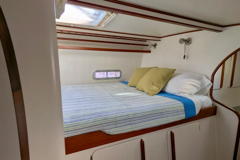 Watermark Yacht Photos Pics Cozy cabin interior of 2003 Chris White Atlantic 42 yacht with bed and porthole.