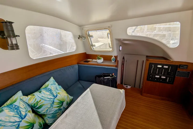 Watermark Yacht Photos Pics Interior of 2003 Chris White Atlantic 42 yacht with cozy seating and nautical decor.