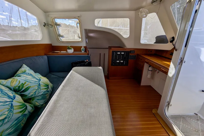 Watermark Yacht Photos Pics Interior of 2003 Chris White Atlantic 42 yacht with cozy seating and wooden accents.