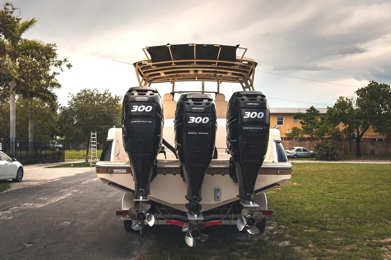  Yacht Photos Pics 2017 Chris-Craft Catalina 34 with triple 300 horsepower outboard engines, parked outdoors.