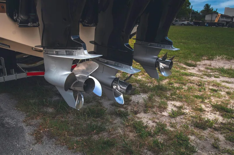  Yacht Photos Pics Propellers of a 2017 Chris-Craft Catalina 34 boat on grassy terrain.