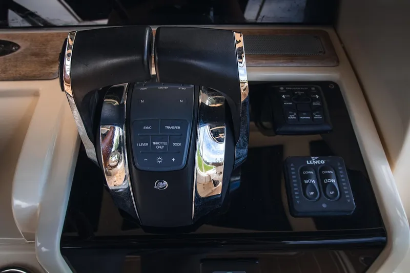  Yacht Photos Pics 2017 Chris-Craft Catalina 34 throttle controls and dashboard with Lenco trim tab switches.