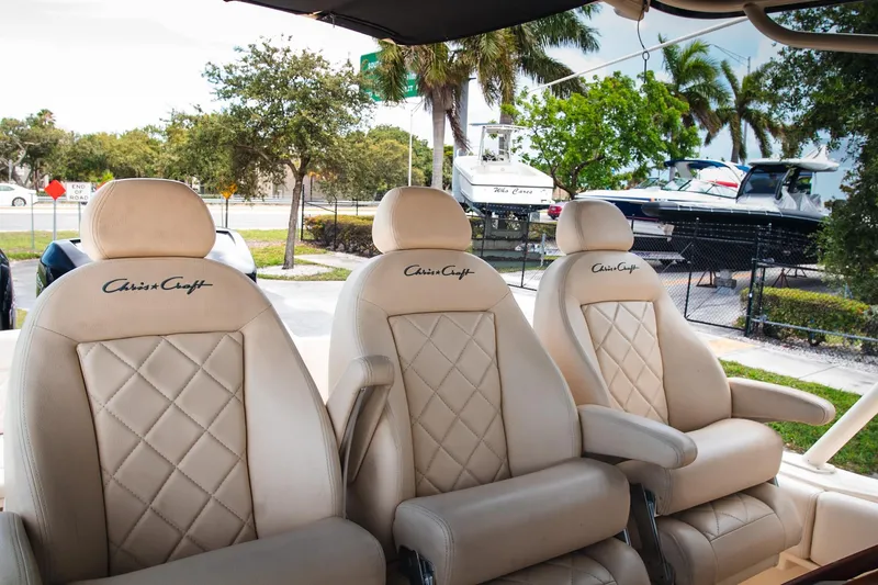  Yacht Photos Pics Luxurious beige seating on 2017 Chris-Craft Catalina 34 boat, featuring diamond stitching and armrests.