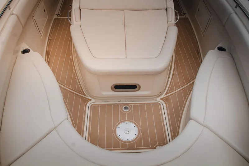  Yacht Photos Pics 2017 Chris-Craft Catalina 34 boat interior with beige seating and wooden flooring.