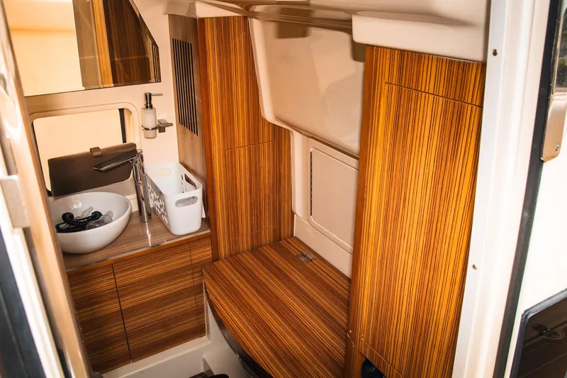  Yacht Photos Pics Luxurious 2017 Chris-Craft Catalina 34 interior with elegant wood finish and modern amenities.