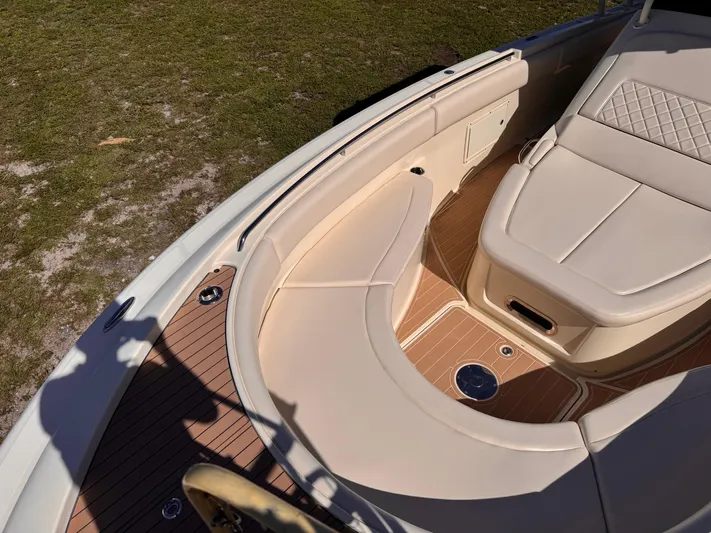  Yacht Photos Pics 2017 Chris-Craft Catalina 34 boat interior with beige seating and wooden deck.