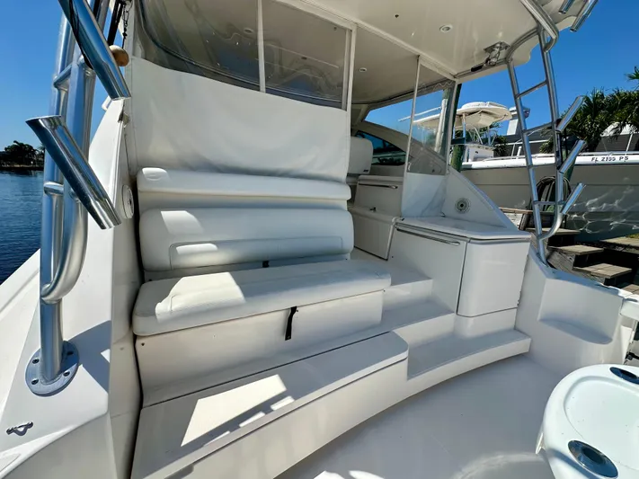  Yacht Photos Pics 2018 Tiara Yachts 4300 Open interior with white seating and sleek design.